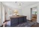 Bright office space with a large work table, stylish rug, and elegant chandelier at 2965 Village Dr, Marietta, GA 30062