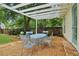 Charming patio with a pergola, table, and chairs, perfect for enjoying outdoor relaxation and gatherings at 2965 Village Dr, Marietta, GA 30062