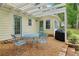 Outdoor patio area with a pergola, table, chairs, and grill, perfect for outdoor dining and entertaining at 2965 Village Dr, Marietta, GA 30062