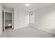 Light and airy bedroom showcases soft carpeting and natural light from the window at 706 Smokey Quartz Way, Kennesaw, GA 30144