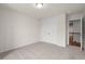 Bedroom with carpet flooring, a closet, and a view of the landing at 706 Smokey Quartz Way, Kennesaw, GA 30144