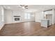 Spacious living room with a fireplace, ample natural light, and hardwood floors at 706 Smokey Quartz Way, Kennesaw, GA 30144