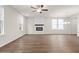 Inviting living room featuring a modern fireplace and abundant natural light at 706 Smokey Quartz Way, Kennesaw, GA 30144