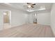 Expansive main bedroom with plush carpet, tray ceiling, and doors leading to the ensuite and closet at 706 Smokey Quartz Way, Kennesaw, GA 30144