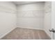A functional walk-in closet with carpet and wire shelving at 706 Smokey Quartz Way, Kennesaw, GA 30144