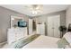Bedroom featuring a ceiling fan, a dresser, and natural light at 146 Sunset Ln, Woodstock, GA 30189