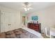 Bedroom features a ceiling fan, a dresser, and a window with natural light at 146 Sunset Ln, Woodstock, GA 30189