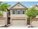 Charming townhome with a two-car garage and well-manicured landscaping at 146 Sunset Ln, Woodstock, GA 30189