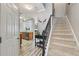Foyer with staircase, wood floors, and decorative accents creating a warm ambiance at 146 Sunset Ln, Woodstock, GA 30189