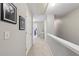 Upstairs hallway with neutral carpet, white trim, and doors leading to various rooms at 146 Sunset Ln, Woodstock, GA 30189