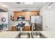 Modern kitchen with stainless steel appliances, spacious counters, and wood cabinetry at 146 Sunset Ln, Woodstock, GA 30189