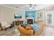 Cozy living room with a fireplace, neutral walls, and ample natural light at 146 Sunset Ln, Woodstock, GA 30189