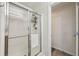 Bathroom shower with glass sliding door and mounted shower caddy at 146 Sunset Ln, Woodstock, GA 30189