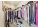 Spacious walk-in closet with ample hanging space, shelving, and shoe storage for organized living at 146 Sunset Ln, Woodstock, GA 30189