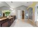 Bright bathroom featuring dual sinks, granite countertops, a glass shower, soaking tub, and neutral tile flooring at 2532 Gloster Mill Drive Southwest, Lawrenceville, GA 30044