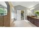 Spacious bathroom featuring dual sinks, granite countertops, a glass shower, soaking tub, and neutral tile flooring at 2532 Gloster Mill Drive Southwest, Lawrenceville, GA 30044