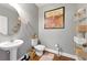 Stylish powder room featuring pedestal sink, modern fixtures, and decorative accents, enhancing its appeal at 2532 Gloster Mill Drive Southwest, Lawrenceville, GA 30044
