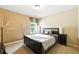Cozy bedroom featuring a palm tree mural and backyard view at 2532 Gloster Mill Drive Southwest, Lawrenceville, GA 30044