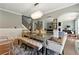 Open-concept dining area featuring a modern table, with seamless flow into the living area at 2532 Gloster Mill Drive Southwest, Lawrenceville, GA 30044