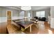 Dining area featuring a large table, hardwood floors, and stylish furniture, ideal for gatherings and entertaining at 2532 Gloster Mill Drive Southwest, Lawrenceville, GA 30044