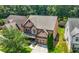 Traditional two-story home showcasing a brick-accented facade, well-manicured landscaping, and a paved driveway at 2532 Gloster Mill Drive Southwest, Lawrenceville, GA 30044