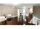 Open landing and hallway area featuring hardwood floors, light-filled design and neutral color scheme at 2532 Gloster Mill Drive Southwest, Lawrenceville, GA 30044
