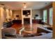 Inviting living room with hardwood floors, a fireplace, built-in cabinets, and a comfortable seating area at 2532 Gloster Mill Drive Southwest, Lawrenceville, GA 30044