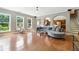 Spacious living room featuring hardwood floors, a comfortable seating area, and sun-filled windows for a relaxing ambiance at 2532 Gloster Mill Drive Southwest, Lawrenceville, GA 30044