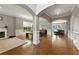 Spacious living room features archways, hardwood floors, fireplace and wainscoting, offering a bright and inviting space at 2532 Gloster Mill Drive Southwest, Lawrenceville, GA 30044