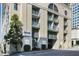 Exterior view of the Buckhead Plaza condominium building, showcasing its architecture and signage at 3040 Peachtree Nw Rd # 1713, Atlanta, GA 30305