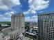 Tall buildings are captured on a bright day with puffy white clouds overhead at 3040 Peachtree Nw Rd # 1713, Atlanta, GA 30305