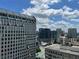 Expansive city view on a partly cloudy day, showcasing urban architecture at 3040 Peachtree Nw Rd # 1713, Atlanta, GA 30305