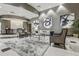 The condominium lobby has a modern design with artwork, comfortable seating, and a sleek reception desk at 3040 Peachtree Nw Rd # 1713, Atlanta, GA 30305