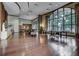 Spacious lounge area with a pool table, comfortable seating, and large windows with natural light at 3040 Peachtree Nw Rd # 1713, Atlanta, GA 30305