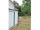 Spacious backyard with storage shed, arbor, and trees at 3604 Orchard Cir, Decatur, GA 30032