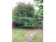 Large backyard with mature trees, shed, and stone pathway at 3604 Orchard Cir, Decatur, GA 30032