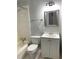 Bathroom showcases a toilet, tub, vanity and framed mirror above the sink at 3604 Orchard Cir, Decatur, GA 30032