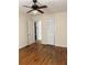 Bedroom showcases a ceiling fan, hardwood floors, closet and neutral colored walls at 3604 Orchard Cir, Decatur, GA 30032