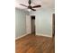 Bedroom featuring hardwood floors, ceiling fan, closet, and ensuite bathroom at 3604 Orchard Cir, Decatur, GA 30032