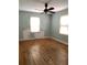 Bedroom with hardwood floors and two windows at 3604 Orchard Cir, Decatur, GA 30032
