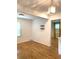 Warm-toned wood floor dining room with white walls and modern lighting fixtures at 3604 Orchard Cir, Decatur, GA 30032