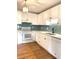 Bright kitchen features white cabinets, subway tile backsplash, stainless steel appliances at 3604 Orchard Cir, Decatur, GA 30032