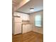 Bright kitchen features a window, white cabinets, wood floors, and stainless-steel appliances at 3604 Orchard Cir, Decatur, GA 30032
