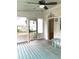 Enclosed porch with wood floors and walls and furniture at 3604 Orchard Cir, Decatur, GA 30032