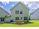 Backyard with a spacious lawn and outdoor dining area at 513 Shadow Valley Ct, Lithonia, GA 30058