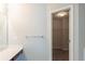 Bright bathroom featuring a walk-in closet with shelving at 513 Shadow Valley Ct, Lithonia, GA 30058