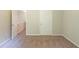 Neutral bedroom featuring a doorway to a hall and a closed door at 513 Shadow Valley Ct, Lithonia, GA 30058