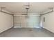 A two car garage with a automatic door at 513 Shadow Valley Ct, Lithonia, GA 30058