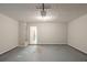 Empty two car garage with a side entrance to the house at 513 Shadow Valley Ct, Lithonia, GA 30058