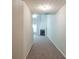 Long hallway leading to the living room with a fireplace at 513 Shadow Valley Ct, Lithonia, GA 30058